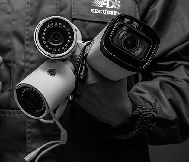 Technician installing cameras